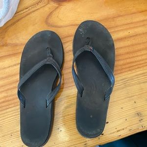 Black rainbow flip flops